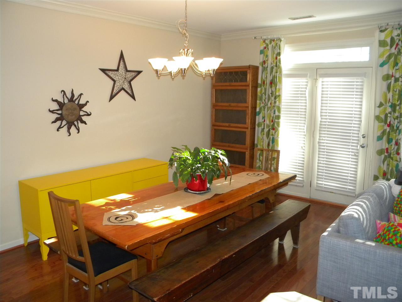 4608 Altha Street Raleigh, NC 27606 - Photo 3 of 12 a view of a dining room with furniture and a potted plant