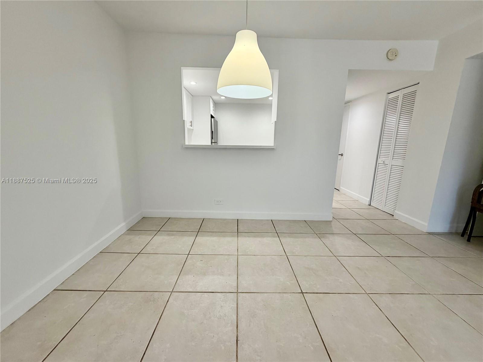 8101 Southwest 72nd Avenue, Unit 219W Miami, FL 33143 - Photo 14 of 30 an empty room with a sink and a mirror