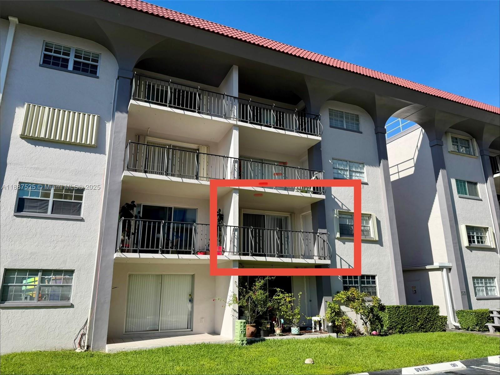 8101 Southwest 72nd Avenue, Unit 219W Miami, FL 33143 - Photo 2 of 30 a front view of a house with garden