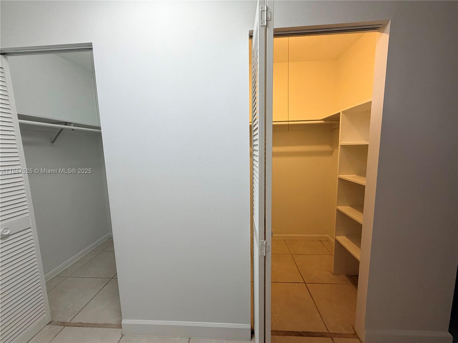 8101 Southwest 72nd Avenue, Unit 219W Miami, FL 33143 - Photo 25 of 30 a bathroom with a glass shower door