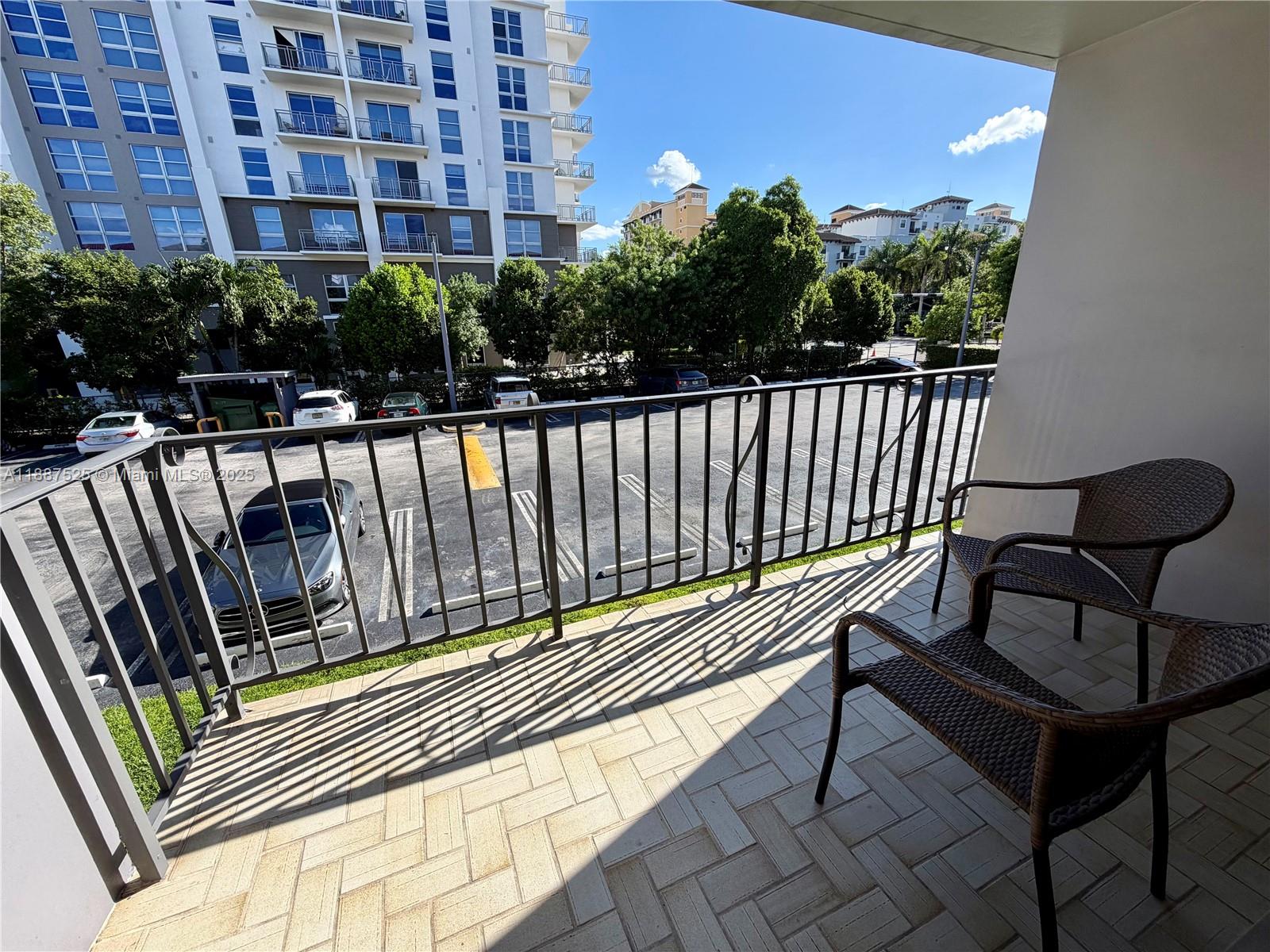 8101 Southwest 72nd Avenue, Unit 219W Miami, FL 33143 - Photo 30 of 30 a balcony with table and chairs