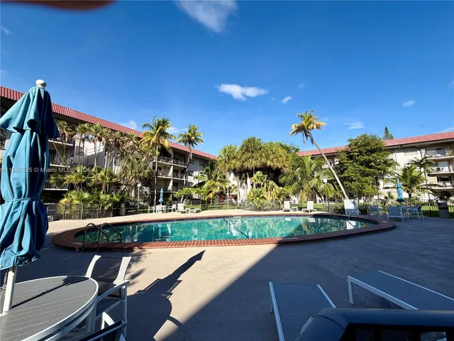 a view of a two chairs in the balcony