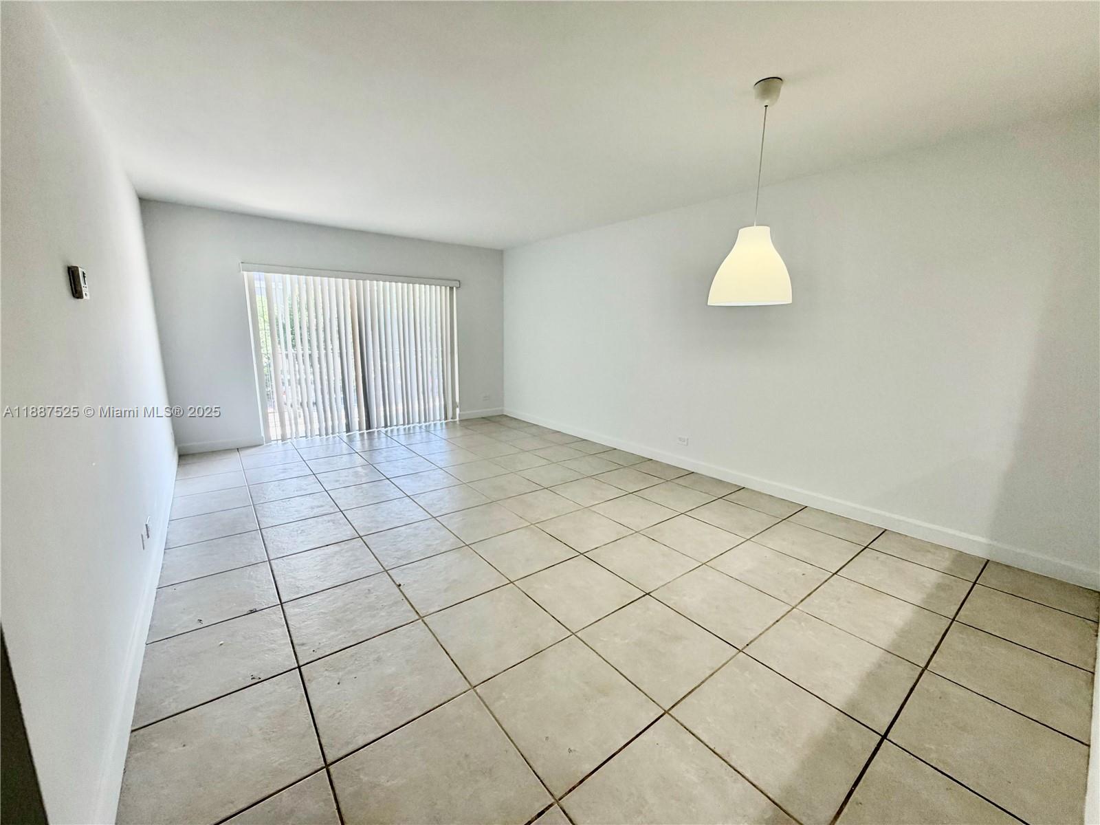 8101 Southwest 72nd Avenue, Unit 219W Miami, FL 33143 - Photo 10 of 30 a view of an empty room and window