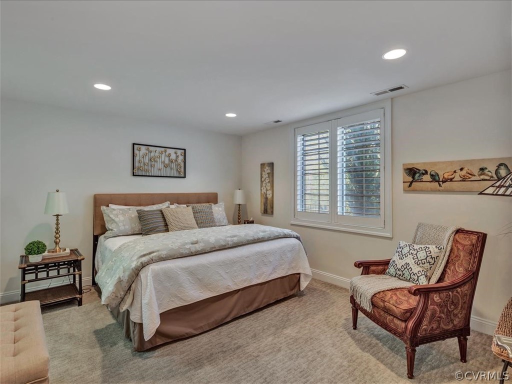 2366 Bel Crest Circle Midlothian, VA 23113 - Photo 27 of 37 a spacious bedroom with a bed a couch and a large window
