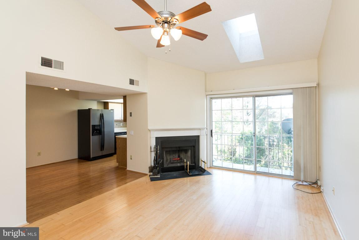 126 Fort Evans Road Southeast, Unit E Leesburg, VA 20175 - Photo 3 of 25 Living Room w/ wood burning fireplace