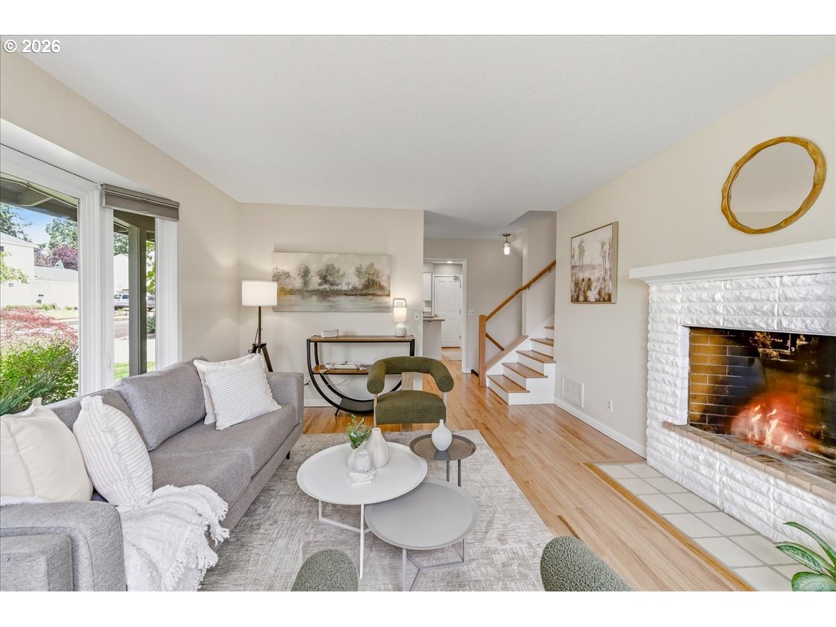 3130 Southwest 116th Avenue Beaverton, OR 97005 - Photo 21 of 44 a living room with furniture and a fireplace