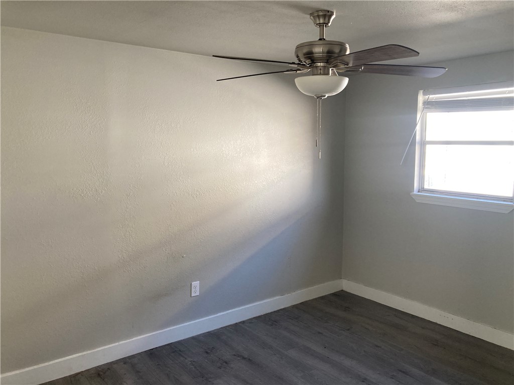 600 West St Marys Street Mathis, TX 78368 - Photo 8 of 11 a room with a window and a chandelier
