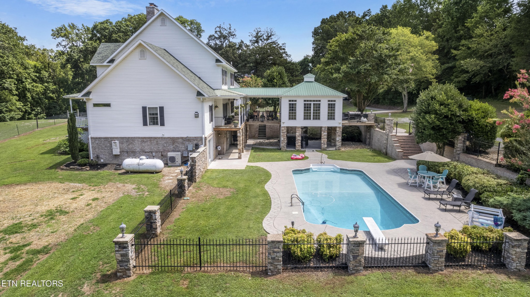 316 Red Hill Road Andersonville, TN 37705 - Photo 3 of 59 an aerial view of a house with swimming pool garden and patio