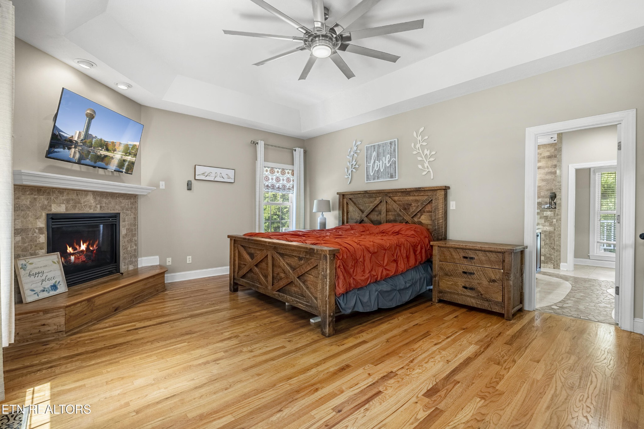316 Red Hill Road Andersonville, TN 37705 - Photo 33 of 59 a bedroom with a bed and a fireplace