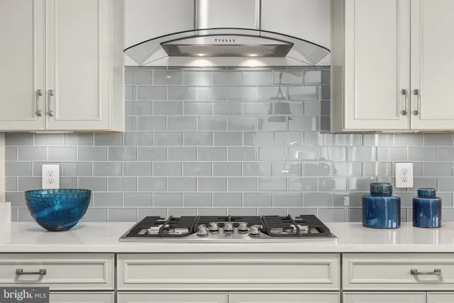 a kitchen with a stove and cabinets
