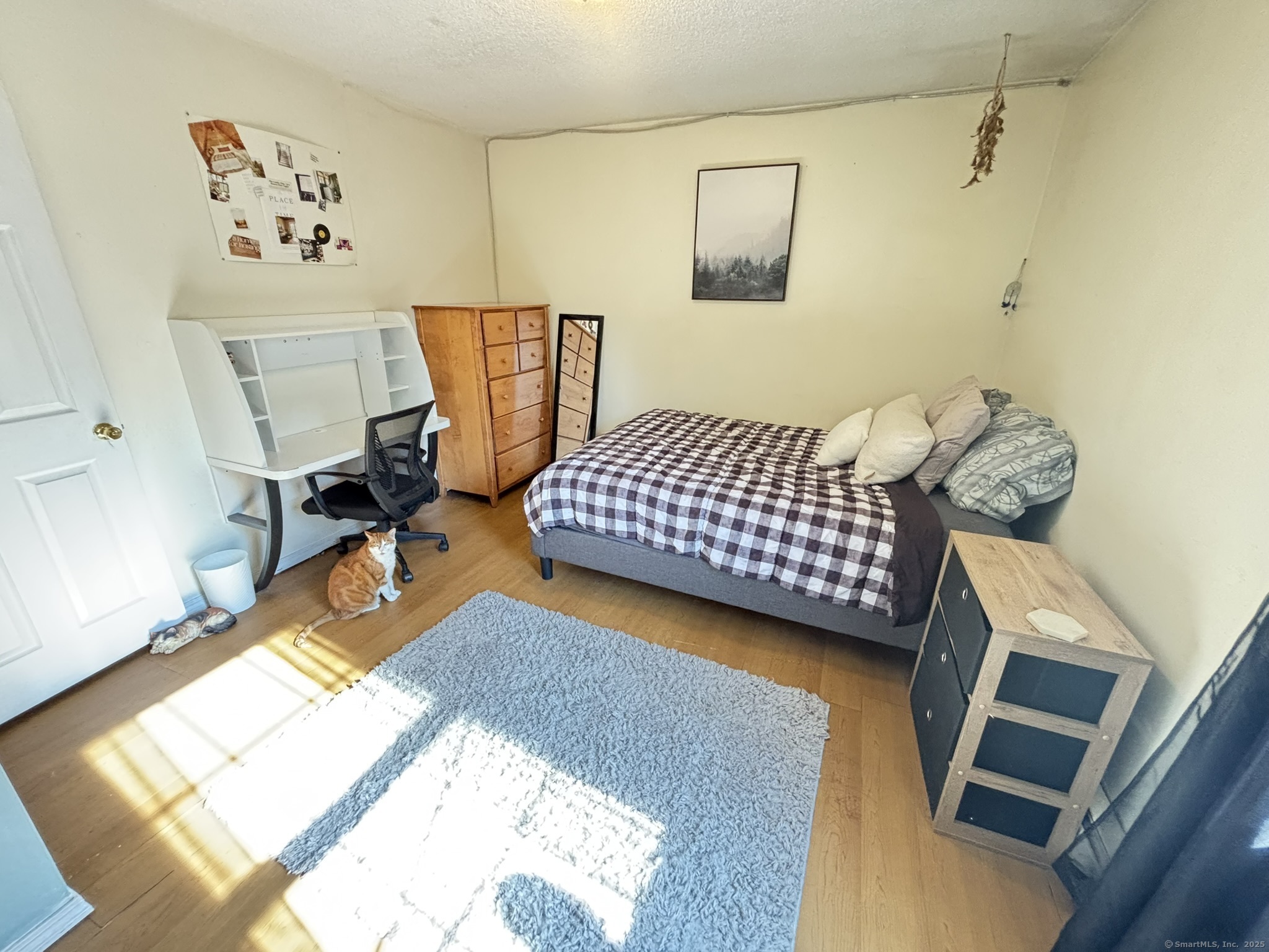 16 Plank Road Prospect, CT 06712 - Photo 18 of 40 a bedroom with a bed and wooden floor