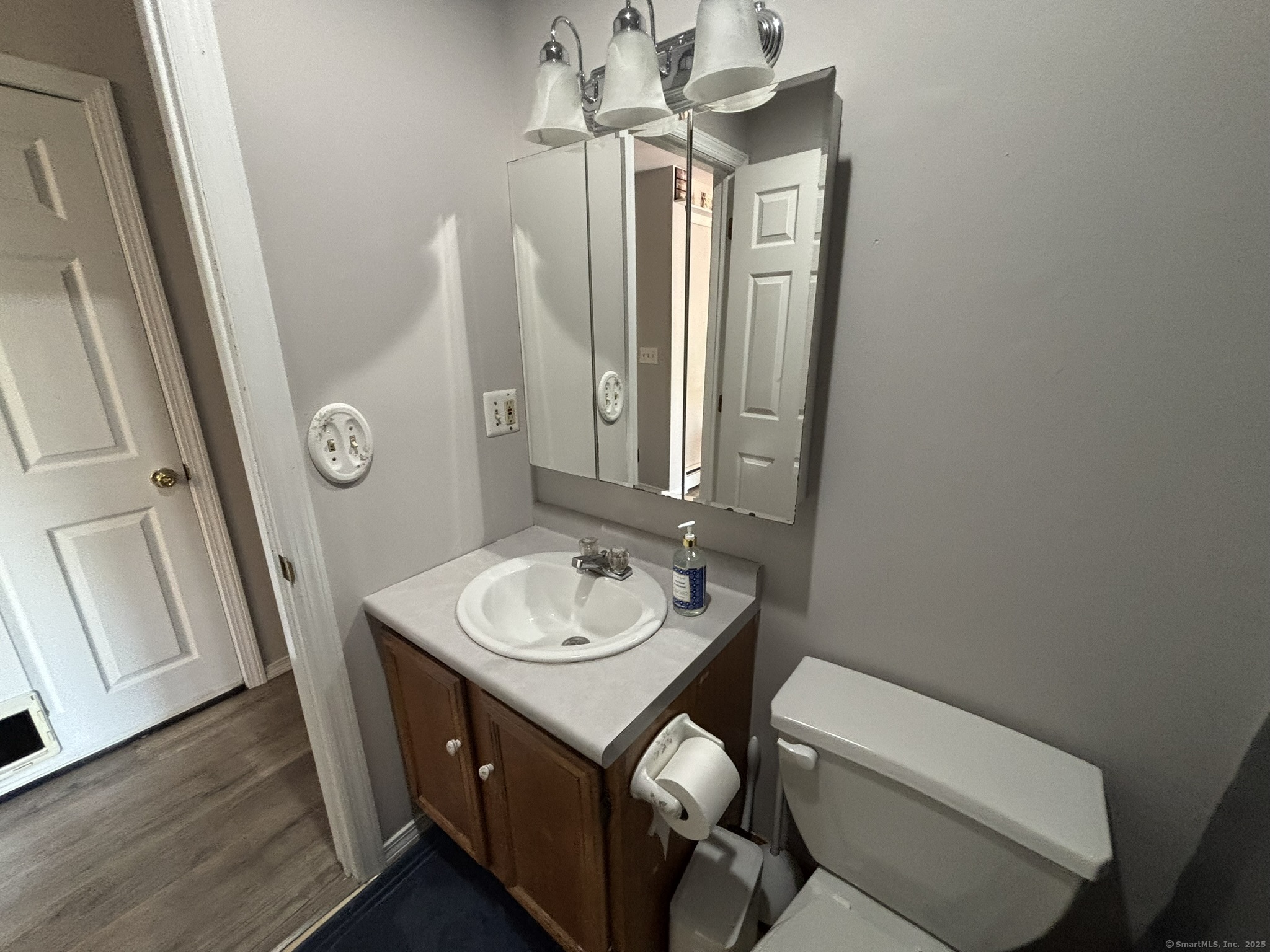16 Plank Road Prospect, CT 06712 - Photo 19 of 40 a bathroom with a sink a toilet and mirror