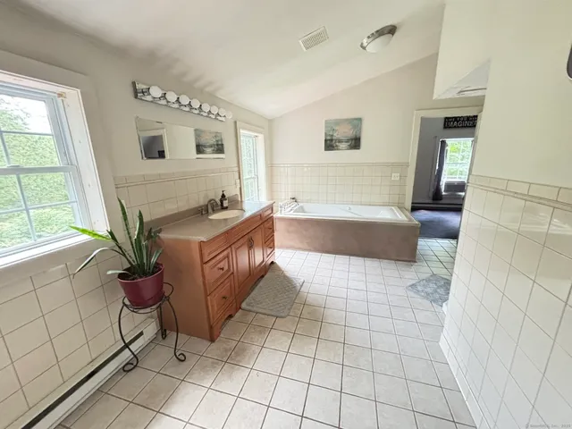 a view of kitchen with sink microwave and refrigerator