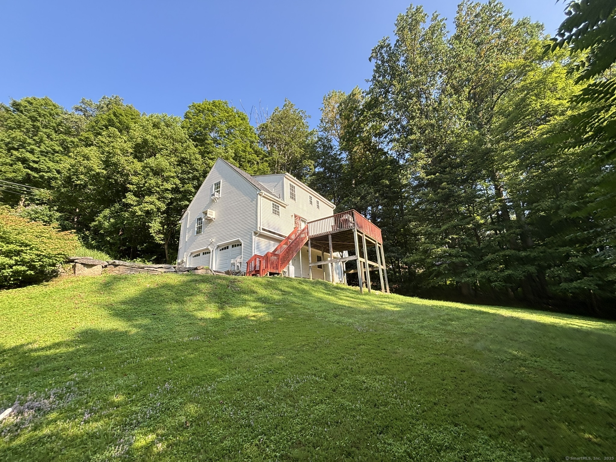 16 Plank Road Prospect, CT 06712 - Photo 32 of 40 a house that is sitting in the grass with large trees