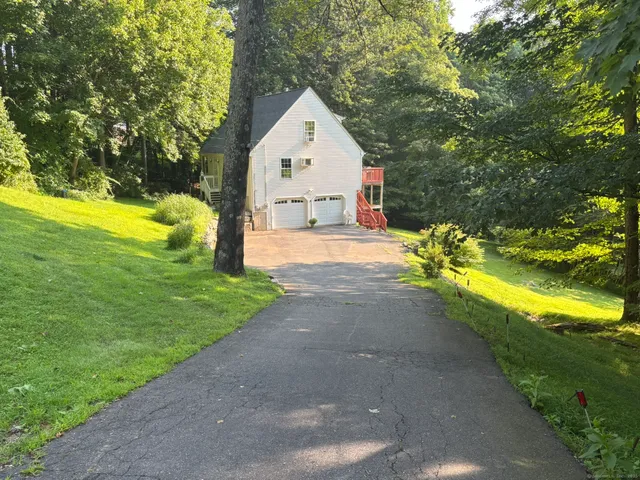 a view of a tiny house with a yard