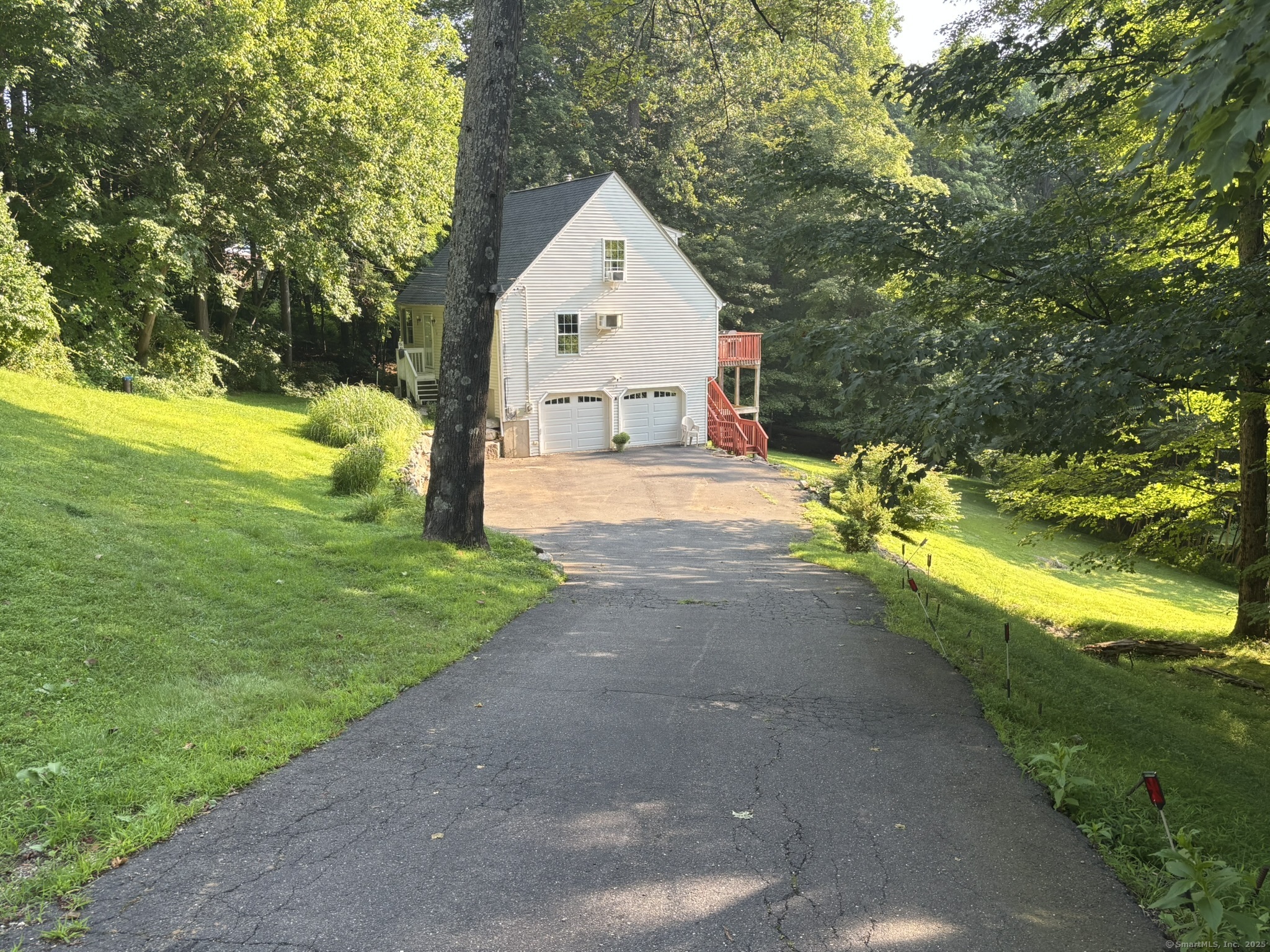 16 Plank Road Prospect, CT 06712 - Photo 33 of 40 a front view of a house with a yard and garage