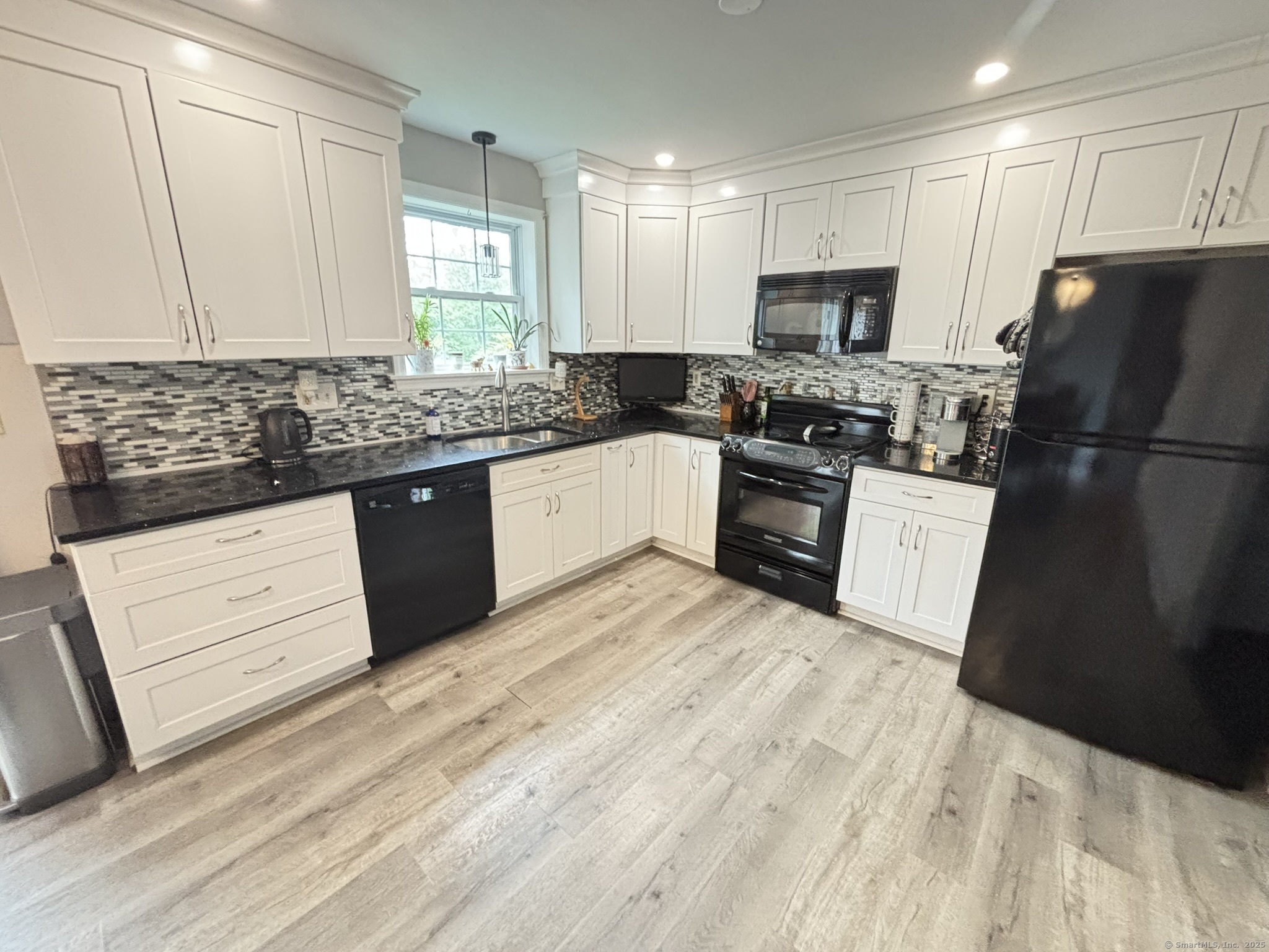 16 Plank Road Prospect, CT 06712 - Photo 5 of 40 a kitchen with granite countertop a refrigerator stove top oven and sink