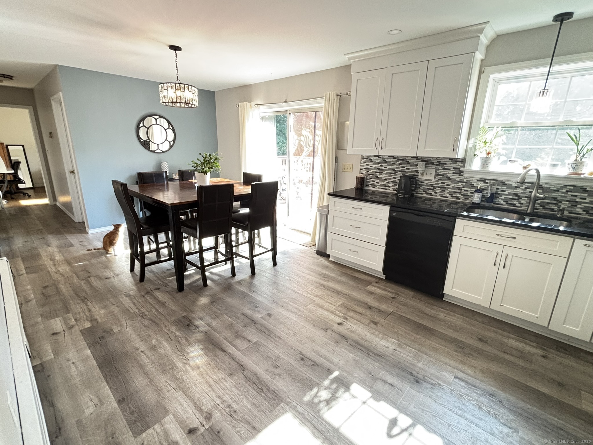 16 Plank Road Prospect, CT 06712 - Photo 7 of 40 a large kitchen with granite countertop a sink white cabinets dining table and chairs
