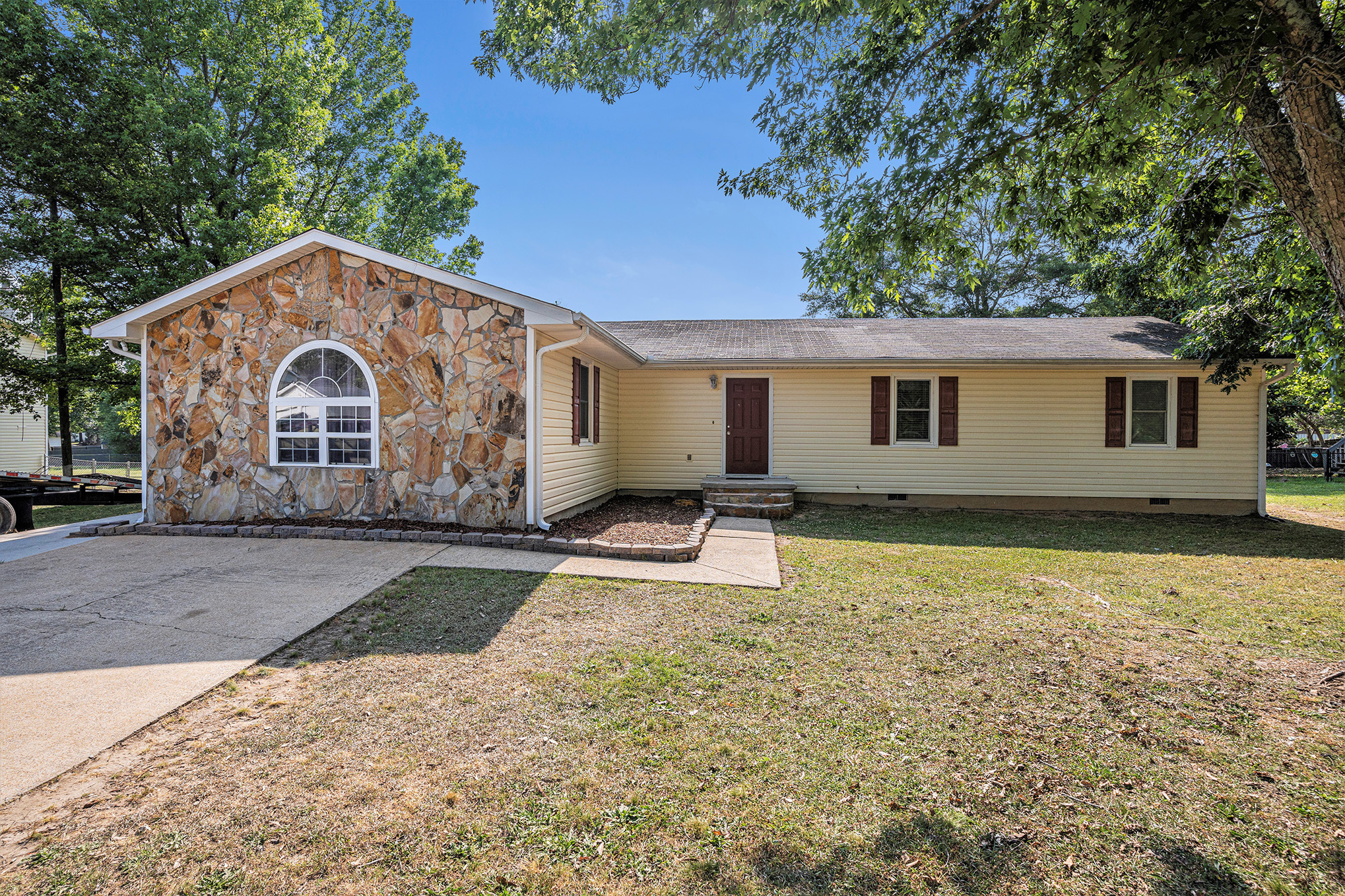 104 Timber Mill Circle Carrollton, GA 30116 - Photo 1 of 1 a front view of a house with garden