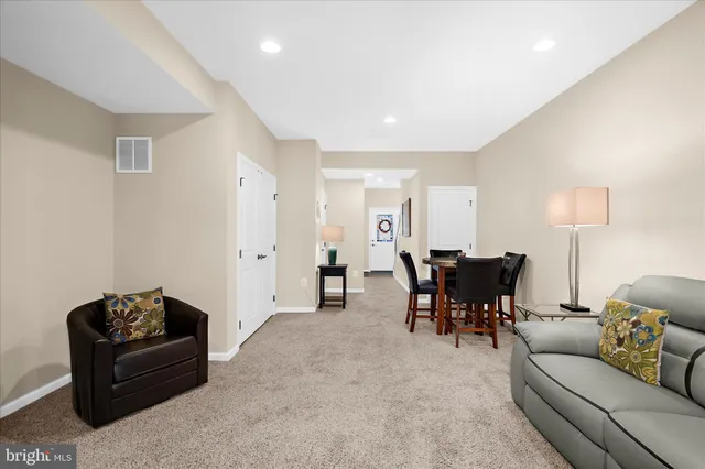 a bedroom with a bed and chair