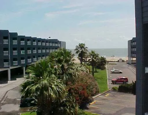 a backyard of a building with glass door and outdoor space
