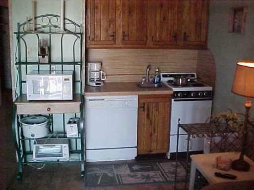 a kitchen with a stove and a cabinets
