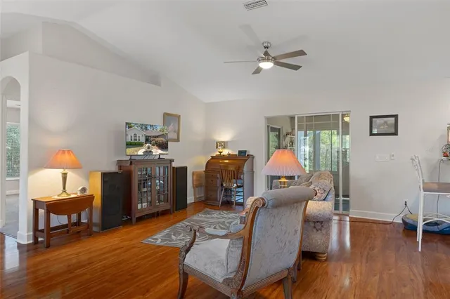 a view of a livingroom with furniture and a window