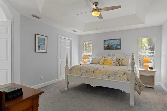 a bedroom with a bed and a television