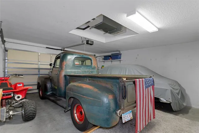 a view of a field with trees in front of it