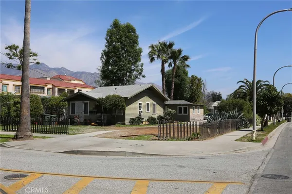 a view of houses with a street