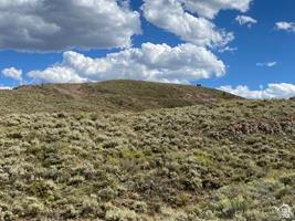 800 Homestead Road Road Cokeville, WY 83114 - Photo 17 of 49 Expansive undeveloped land featuring natural terrain and a clear sky backdrop
