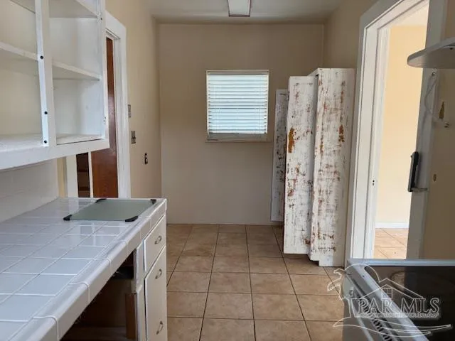 a kitchen with stainless steel appliances granite countertop a sink and a stove