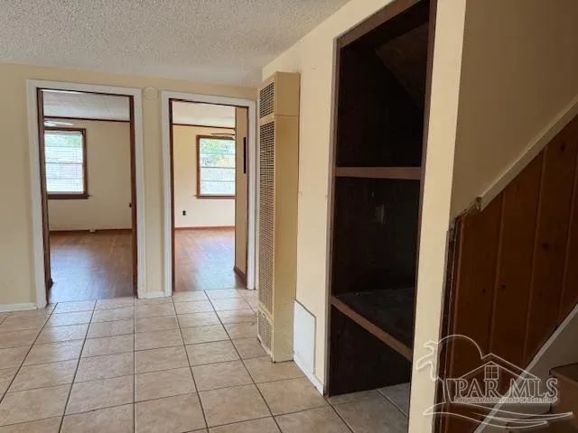 a view of a closet area with living room