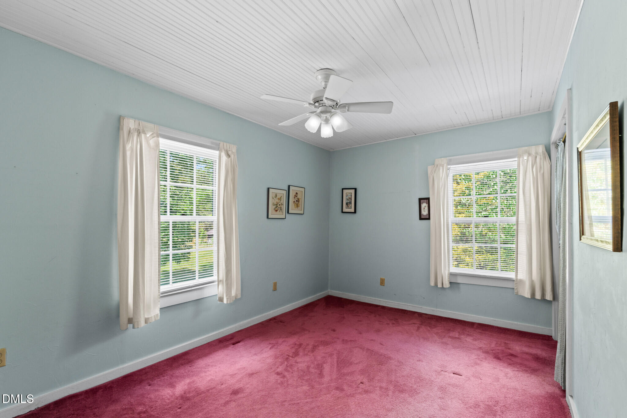 3415 Mt Willing Road Efland, NC 27243 - Photo 20 of 36 an empty room with windows and fan