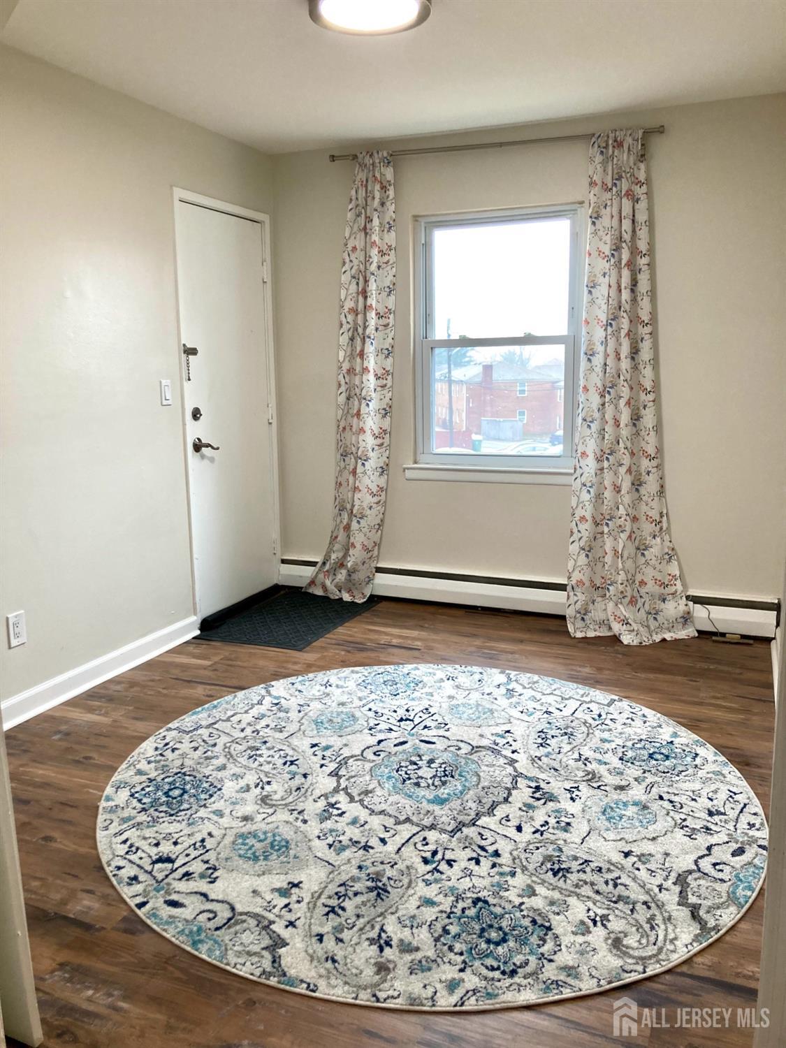 50 Fox Road, Unit 4A Edison, NJ 08817 - Photo 8 of 22 a view of a room with wooden floor and a window