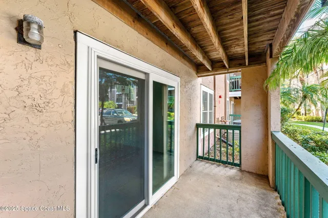 a view of a swimming pool with chairs