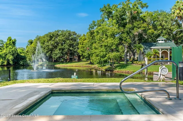 a view of a swimming pool with a lake view