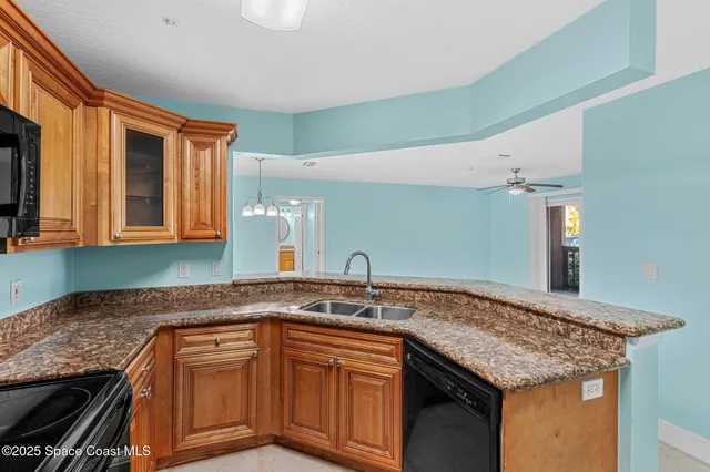 a view of a room with a kitchen