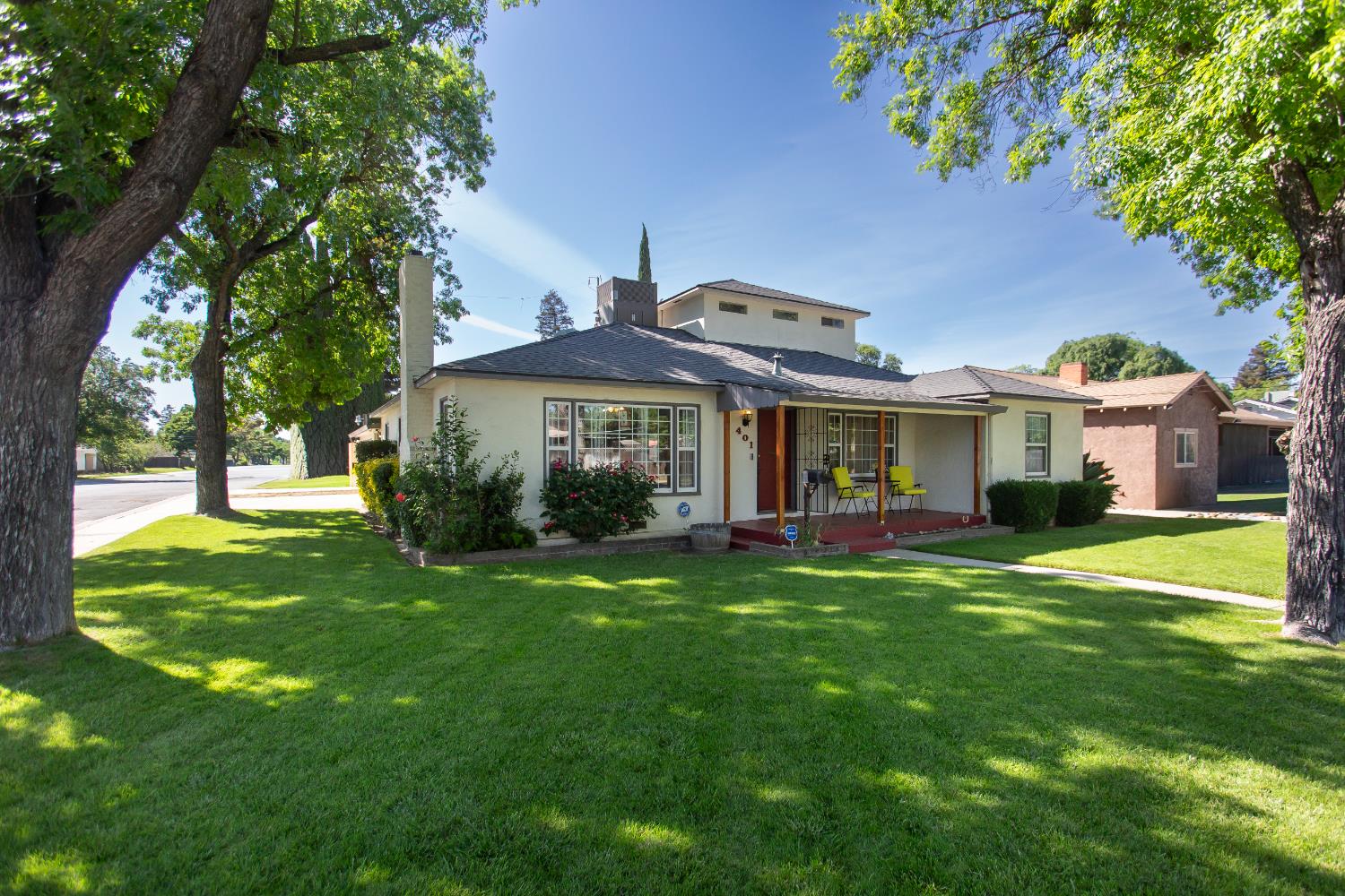 401 Fortuna Avenue Modesto, CA 95354 - Photo 4 of 43 a front view of a house with a garden
