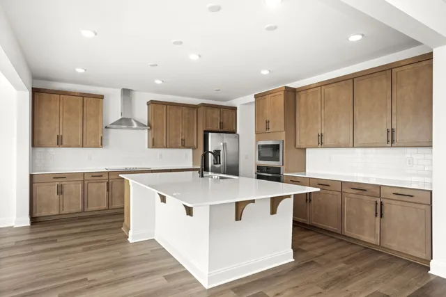 a kitchen with counter space cabinets and appliances