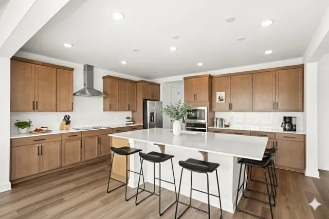 a kitchen with a sink window and refrigerator