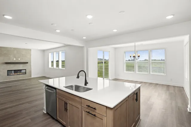 a view of an empty room with wooden floor livingroom and outdoor view