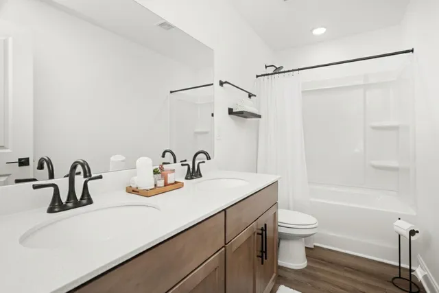 a bedroom with bed furniture and a large window