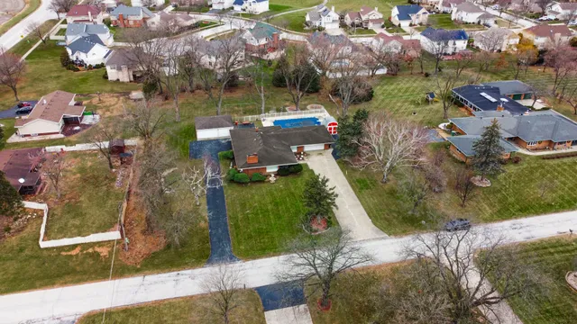 an aerial view of residential houses with outdoor space