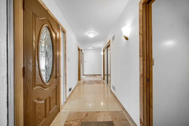 a view of a hallway with windows