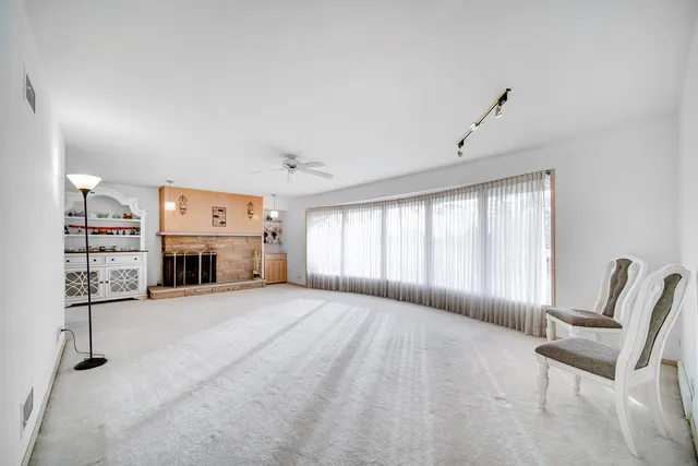 a view of a livingroom with furniture and windows