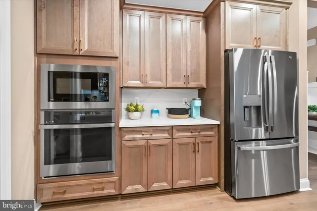 a kitchen with appliances and cabinets