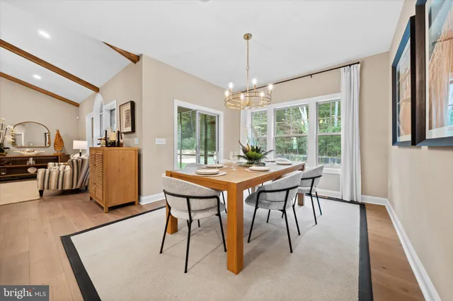 a dining room with furniture and window