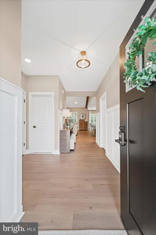 a view of a living room hardwood floor and a ceiling fan