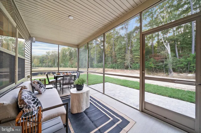 a living room with large windows